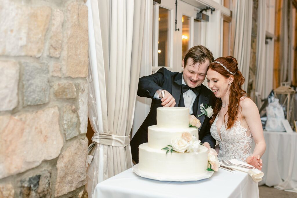 Bride and groom cutting cake at Fiddler's Elbow Country Club
