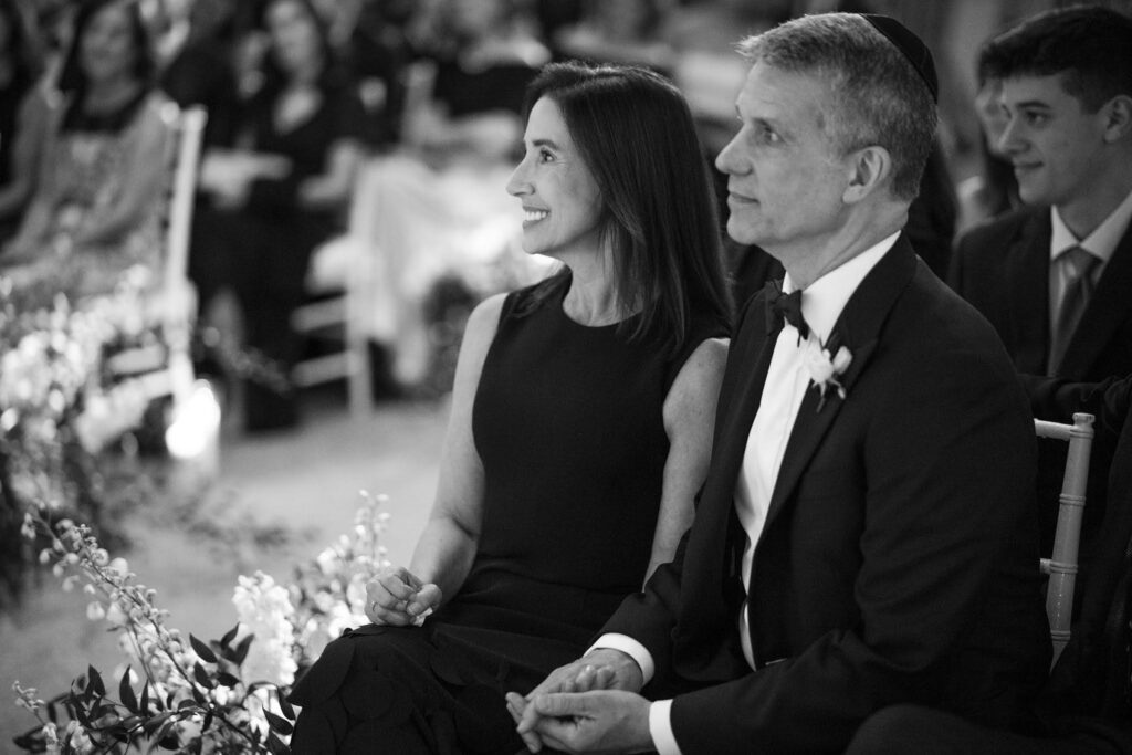 Parents of the groom during wedding ceremony black and white portrait 