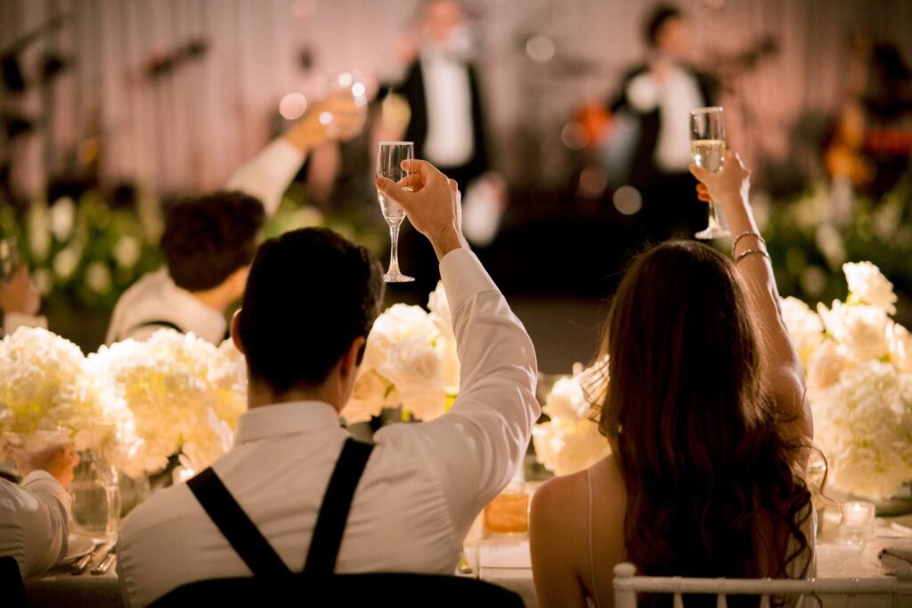 Bride and groom toast during wedding reception speeches